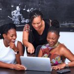 ladies looking on to a laptop